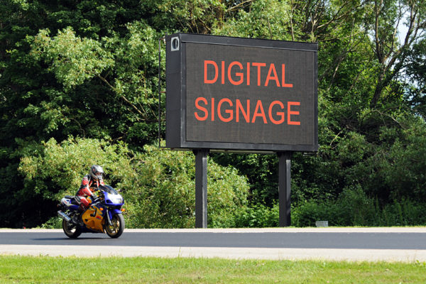 a sign that says digital signage. Whoa. Trippy.