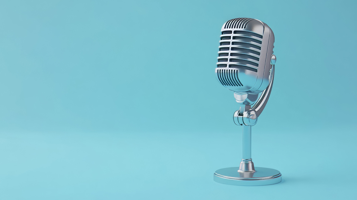 Podcasting microphone on a blue background