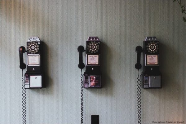 Rotary Pay Phones on a wall