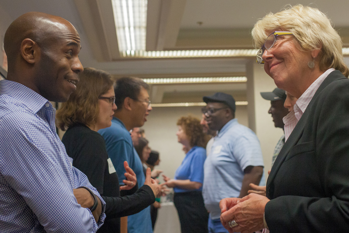 Attendee conversation at the Academies