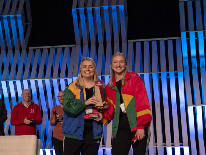 Mackenzie Huber and Whitney Tabbert accept their Best of Conference award at the HighEdWeb Annual Conference.